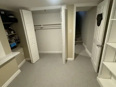 Basement closet doors with stairs visible