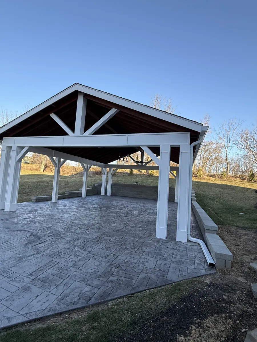 Pavilion with stamped concrete and stone retaining wall