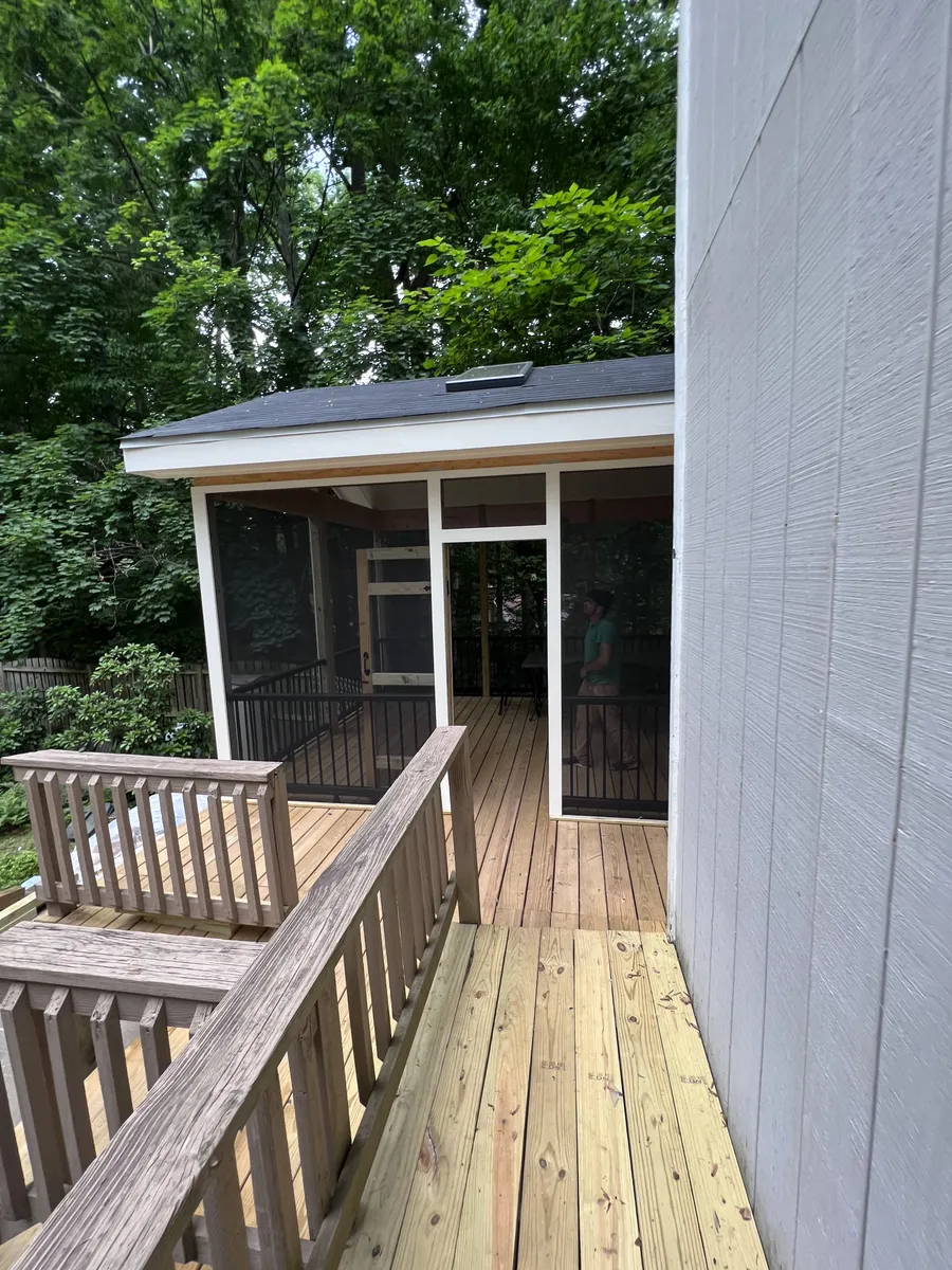 Wood deck with screened porch addition