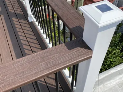 close-up of composite deck railing with solar post cap
