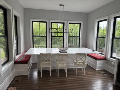 breakfast nook with banquette seating and pendant light