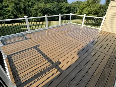 Composite deck with black and white cable railing