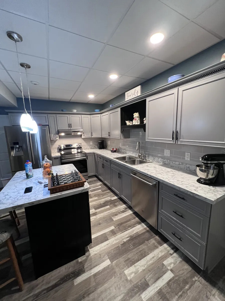 Finished basement with kitchenette and island