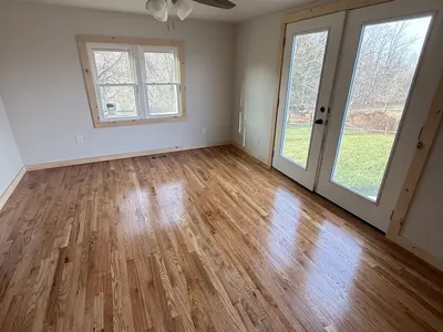 empty room with double french doors and window