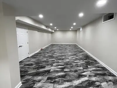 finished basement with marbled vinyl tile flooring