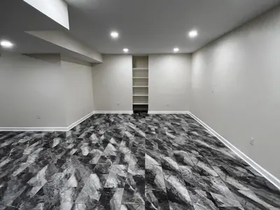 finished basement with built-in shelving niche