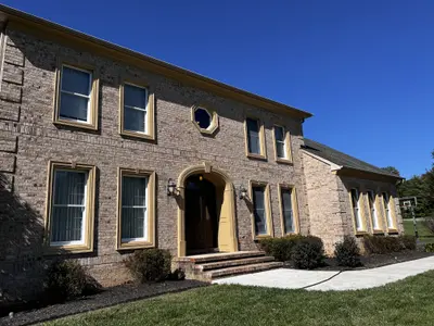 Two-story brick home front facade with windows